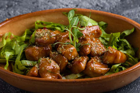 small tasty fresh chicken bites in a rustic bowlの写真素材