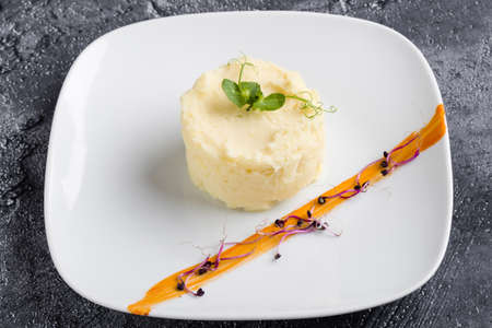 fresh mashed potato portion on white plateの写真素材