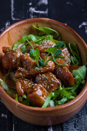 small tasty fresh chicken bites in a rustic bowlの写真素材