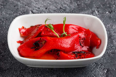 marinated roasted pepper vegetable in white bowlの写真素材