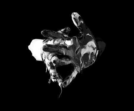 concept image of two hands covered in black and white paint touchingの写真素材