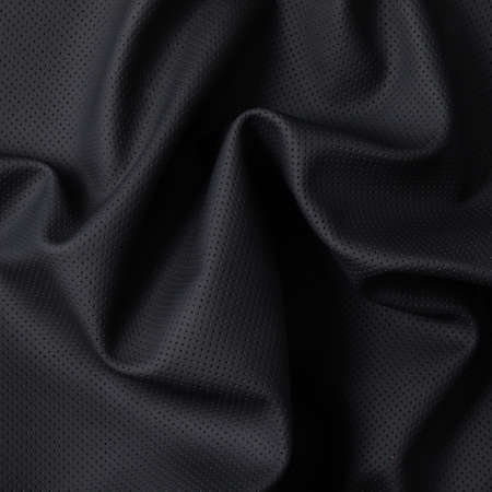 Closeup of dark color leather material texture backgroundの写真素材