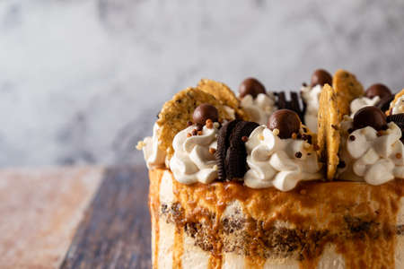 handmade artisanal birthday cake on color backgroundの写真素材