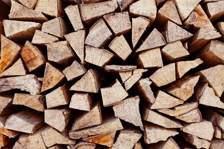Close up of dry chopped firewood on stock prepared for winterの写真素材