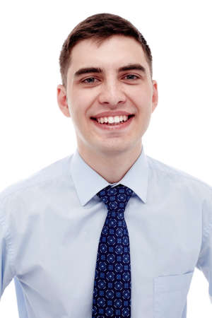 Front portrait of young smiling man wearing blue formal shirt with tie isolated on white background - business conceptの写真素材