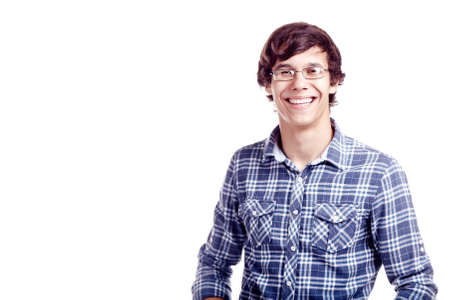 Portrait of young hispanic man wearing glasses and blue shirt standing and smiling isolated on white background, copy spaceの写真素材