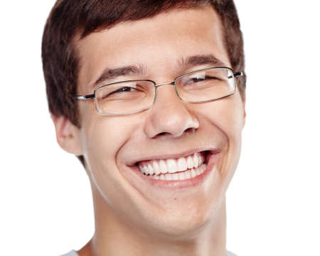 Close up portrait of young cheerful man wearing glasses smiling perfect healthy toothy smile isolated on white background - dentistry or ophthalmology conceptの写真素材