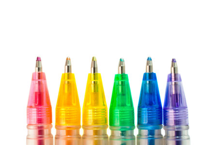 Ballpoint pens of different colors closeup