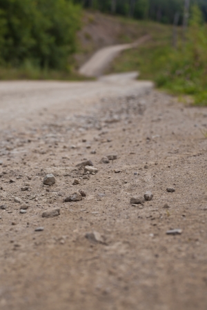 Stones lying on the mountain roadの写真素材