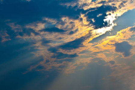 The sun s rays breaking through the clouds