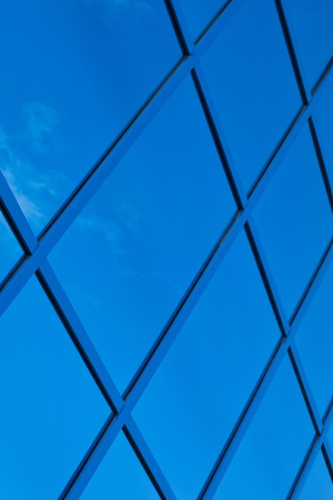 A fragment of blue glass building in the backgroundの写真素材
