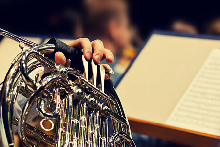  Horn fragment in the hands of a musician の写真素材