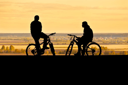 silhouettes of cyclistsの写真素材