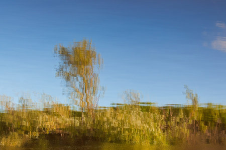 Abstract landscape reflected in water