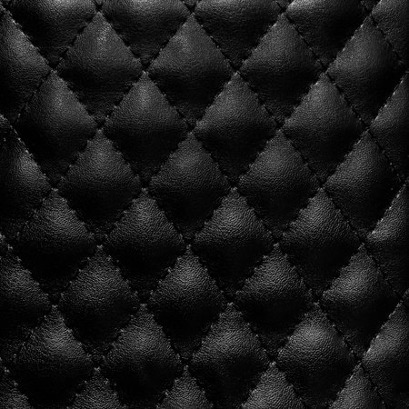 Black quilted leather in the backgroundの写真素材