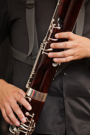 Bassoon in closeup musician handsの写真素材