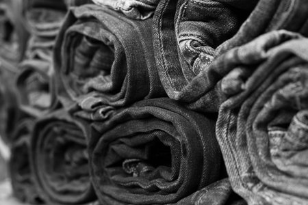 Different folded jeans closeup in black and whiteの写真素材