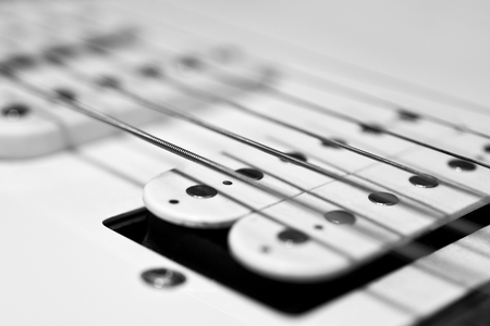 Strings electric guitar closeup in black and whiteの写真素材