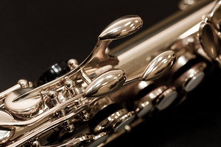 Fragment of a saxophone valves in dark colorsの写真素材