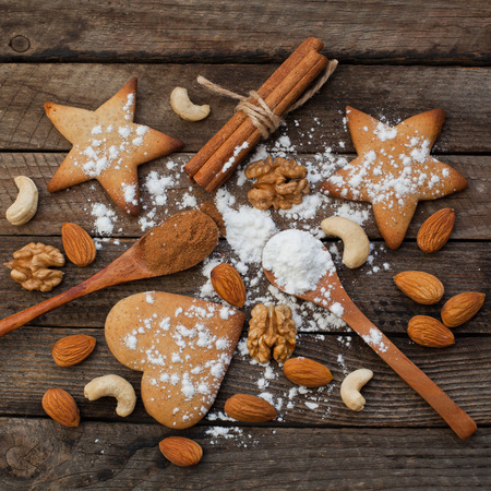 Biscuits and nuts on a wooden backgroundの写真素材