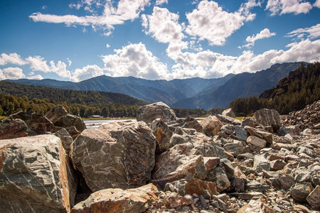 Landscape with stones against the backdrop of mountainsの写真素材