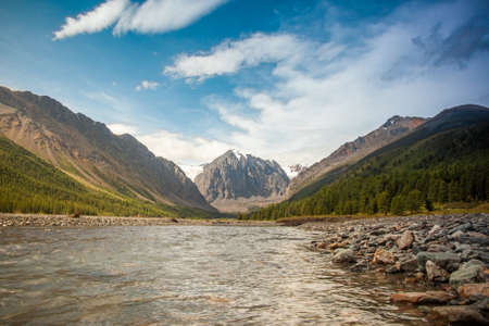 River in the valley among the mountainsの写真素材