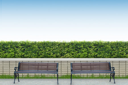 bench and brick fence backgroundの写真素材