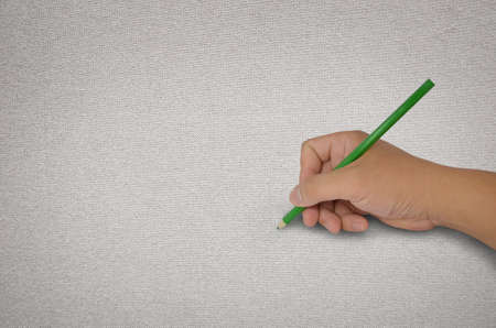 hand drawing with green pencil on fabricの写真素材
