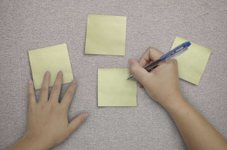 hand writing in paper note on fabric backgroundの写真素材