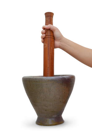 hands with a wooden pestle and mortar on whiteの写真素材