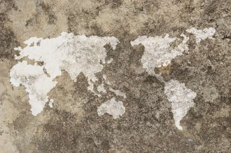 world map on dirty old grunge cement wallの写真素材