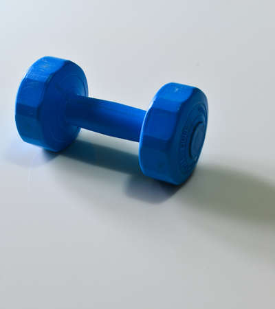 Blue Dumbbell on the Whiteの写真素材