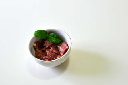 Tenderloin slice in the Bowl with Kaffir Lime Leaf, Pork Preparation to Cookingの写真素材