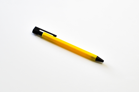 Yellow pen isolated on white backgroundの写真素材
