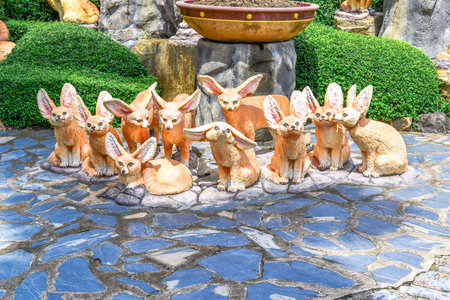 Ten foxes statue like cartoon in the gardenの写真素材