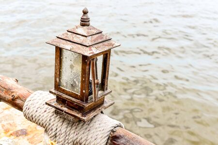 Wood Lamp abstract on the handrail near seaの写真素材