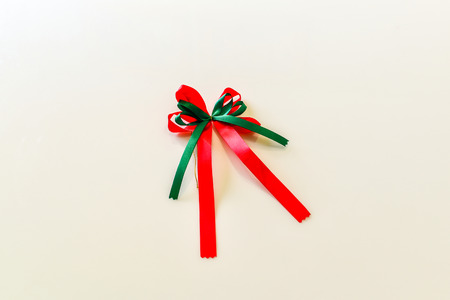 green and red bow ribbon isolated on the white backgroundの写真素材
