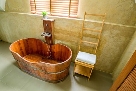 Wooden bathtub in the bathroom, loft styleの写真素材