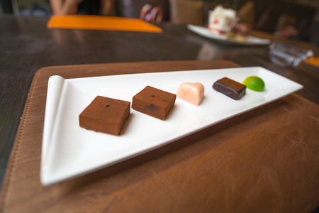 Five style of chocolate in white dish, girl like itの写真素材
