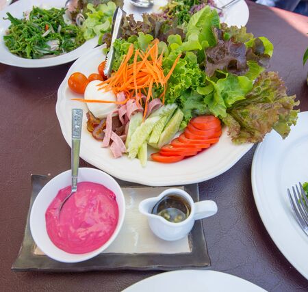 Egg Salad on a table with raspberry cream sauce, Thailand styleの写真素材