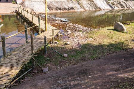 Wood (Bamboo) Bridge across the Canal in countryside of Northern Thailandの写真素材