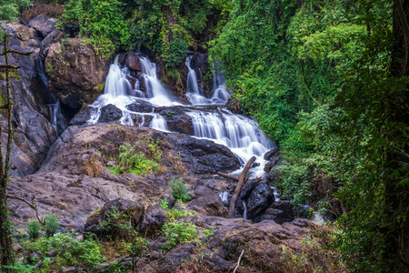 Long exposure picture of waterfall in the forest, blurred motion of water (Pha Suea National Park, Thailand)の写真素材
