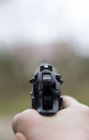 aiming the target with asg gunの写真素材