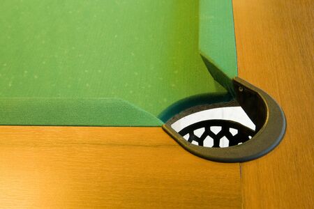 corner of pool table with pocket