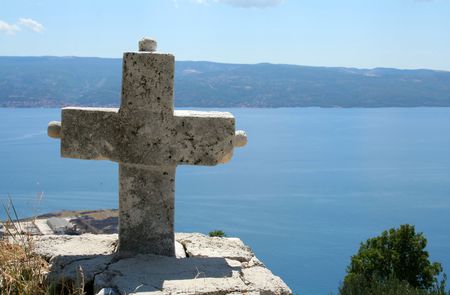 lonely cross over the seaの写真素材