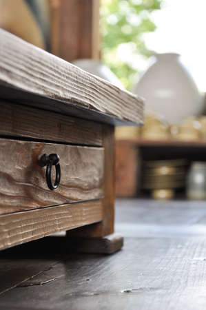 hidden drawer in traditional timber table with a soft wooden texture on a sunny afternoon in hahoe folk village, andong, south koreaの写真素材