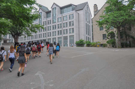 SEOUL, SOUTH KOREA - AUGUST 2012 - Group of female students walking up a hill towards Posco Building, Ewha Womans University.のeditorial素材