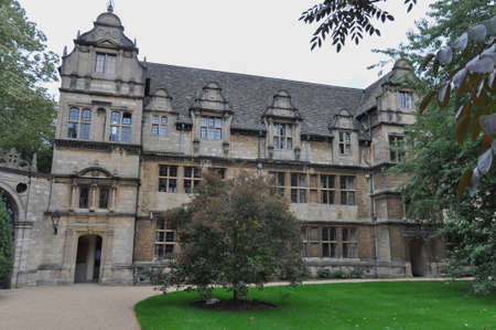 View of decorative garden gate from Trinity College Garden Quad, Oxford, United Kingdom. Overcast Sky.のeditorial素材