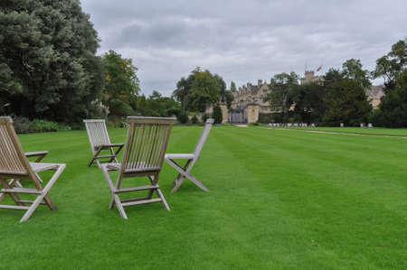 View of lawn and building facade with decorative planting from Hertford College Old Quad, Oxford, United Kingdom. Overcast Sky.のeditorial素材