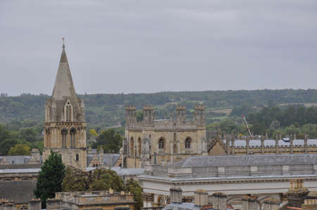 View of lawn and building facade with decorative planting from Hertford College Old Quad, Oxford, United Kingdom. Overcast Sky.のeditorial素材